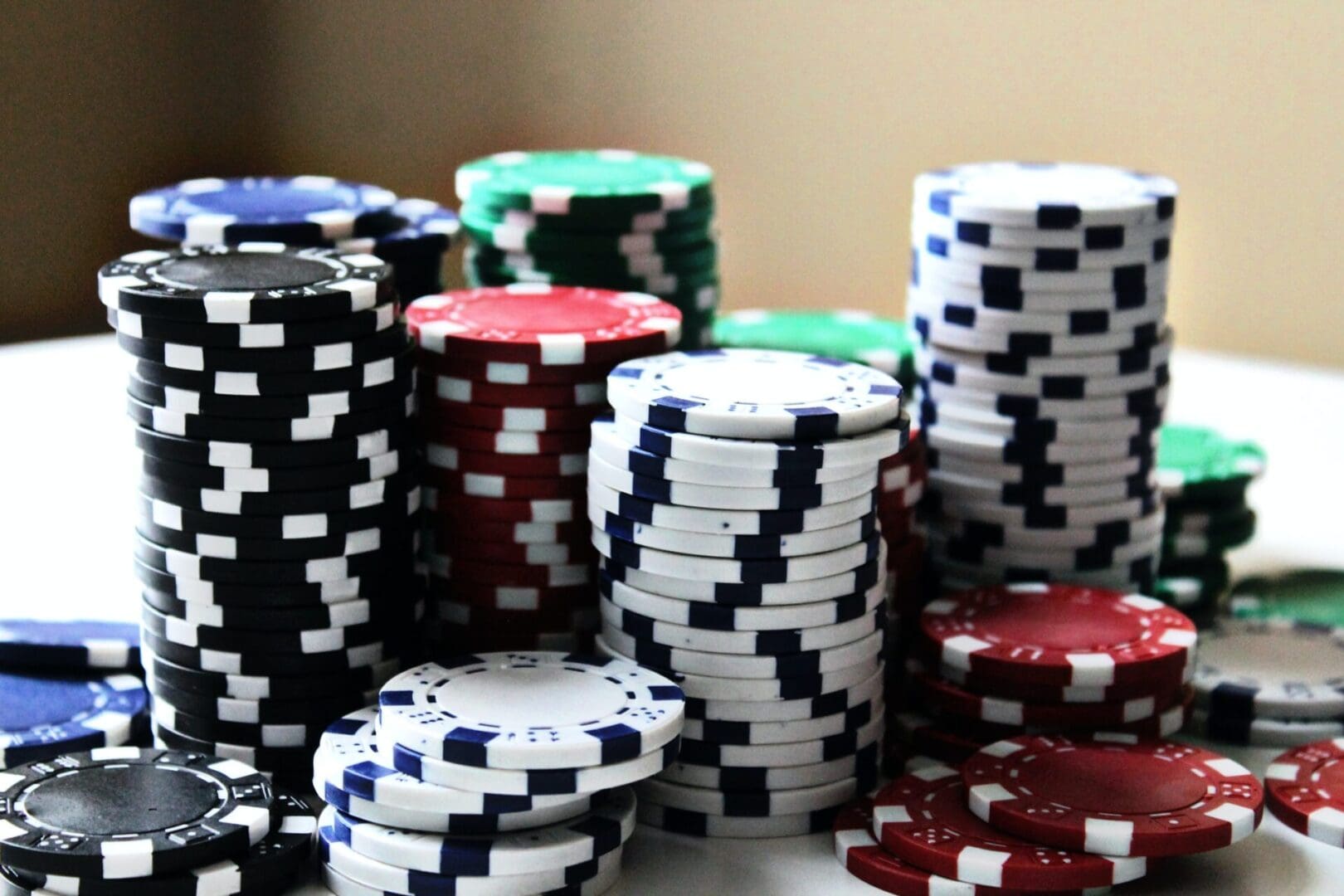 A pile of poker chips sitting on top of a table.