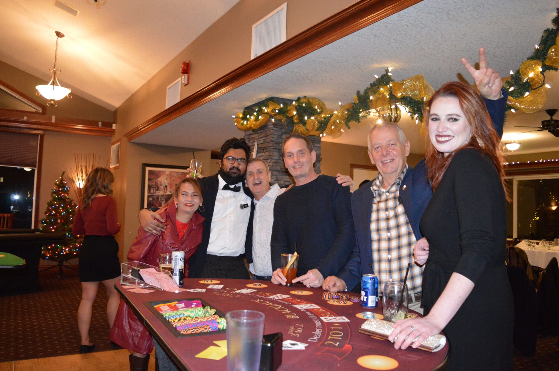 six people enjoying blackjack game