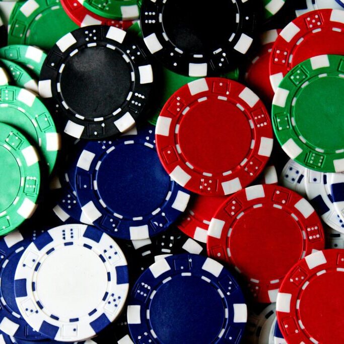 A pile of poker chips in various colors.